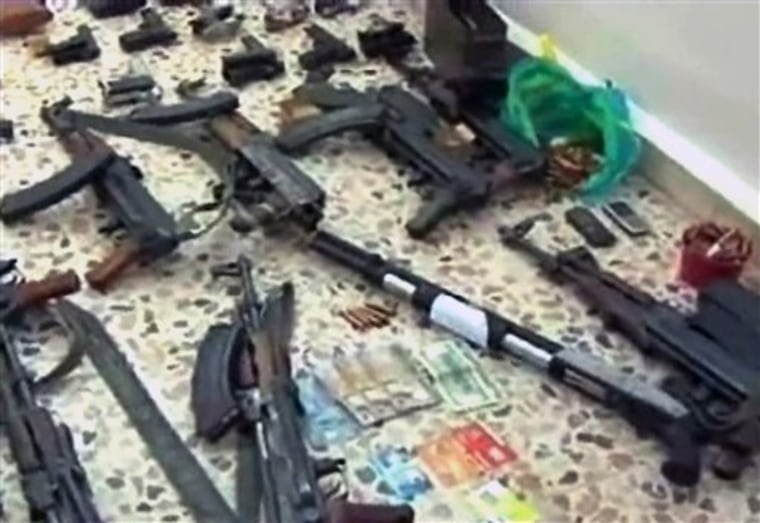 In this photo released by the Syrian official news agency SANA, weapons that were confiscated by armed forces from what they say terrorist groups in the southern province of Daraa, Syria, Wednesday, April 27, 2011. The Syrian armed forces said in a statement carried by state-run news agency SANA that army units continued their operations in \"the city of Daraa and its countryside\" chasing \"extremist terrorist groups.\" Assad has blamed most of the unrest on a \"foreign conspiracy\" and armed thugs, and has used state media to push his accusations. (AP Photo/SANA) EDITORIAL USE ONLY